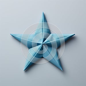 Little Star: Blue Origami Star On Gray Background Stock Photo