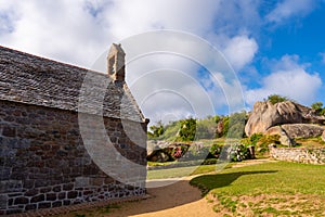 Little stone church of Ploumanac`h in Perros Guirec. Pink granite coast, Perros Guirec, Brittany, France.