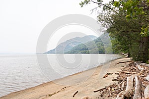 Little Stony Point Beach along the Hudson River in Cold Spring New York during a Foggy Day
