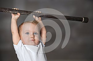 Little strong baby toddler playing sports. Kid during his workout. Success and winner concept