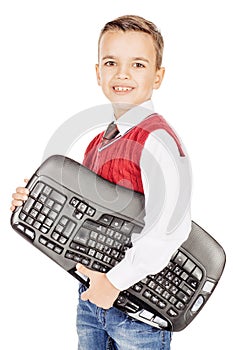 little student boy with keyboard isolated on white studio background. education, school and future technology concept