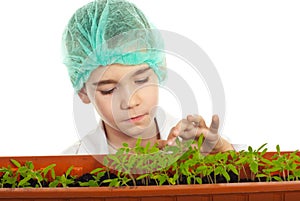 Little student checking new plants