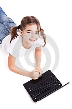 Little student girl with a laptop