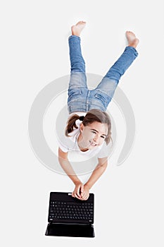 Little student girl with a laptop