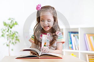 Little student girl studying at preschool