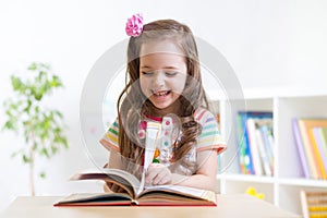 Little student girl studying at preschool photo