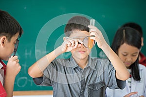 Little students study science in classroom