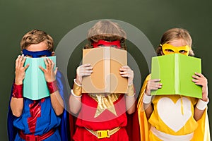 Little superheroes with books