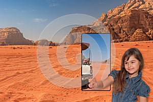 Little tanned girl is offering off-road driving in Wadi Rum, Jordan