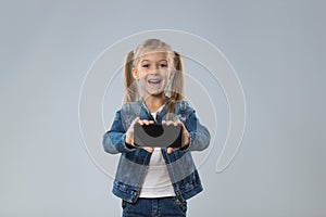 Little Teenage Girl Show Cell Smart Phone Screen With Empty Copy Space, Small Excited Happy Smiling Child