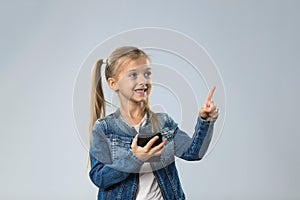 Little Teenage Girl Using Cell Smart Phone, Small Happy Smiling Child Point Finder To Copy Space