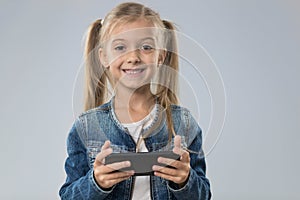 Little Teenage Girl Using Cell Smart Phone, Small Kid Happy Smiling Child