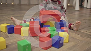 Little toddler boy playing with colorful building blocks. Toddler love to playing with blocks bricks and cubes child