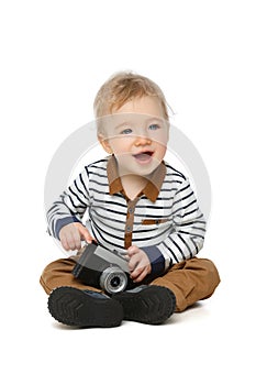 Little toddler boy with retro camera