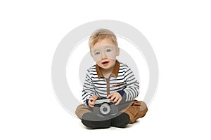 Little toddler boy with retro camera