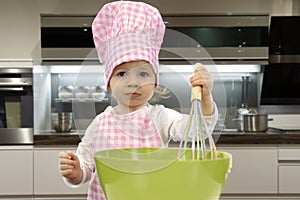 Little toddler cooking pastry