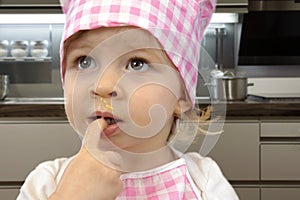 Little toddler cooking pastry