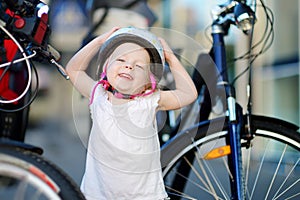 Little toddler girl ready to ride a bike