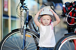 Little toddler girl ready to ride a bike