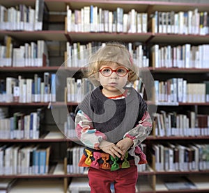 Little toddler in a public library
