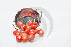 Little tomatoes in white background