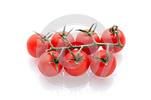 Little tomatos isolated in white background