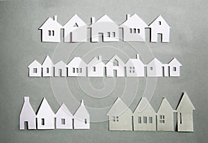 Little town houses in row. Property and house buying concept. Paper cut design background. Paper cut design background.