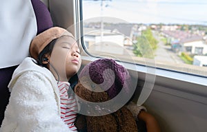 Little traveler listening music and sleep