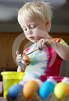 Little Two Year Old Toddler Boy Painting Easter Eggs
