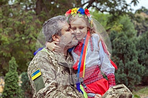 Little Ukrainian girl meets dad from the war