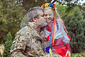 Little Ukrainian girl meets dad from the war