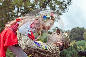 Little Ukrainian girl meets dad from the war