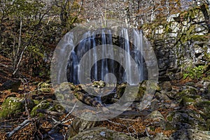 Little Waterfall in a Beautifull Place With Fall Color Rocky Ground and Trees Nature