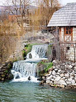 Little waterfall and old house