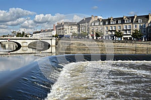 Waterfall on the river Mayenne at Laval in France photo