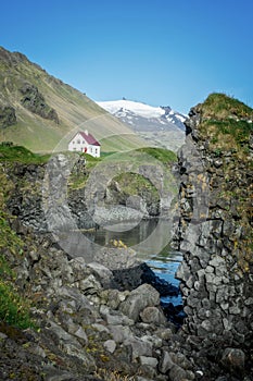 Little white house in Arnarstapi, Snaefellsnes peninsula scenic landscape Iceland