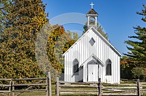 Little White Wooden Church Surrounded by Wooden Fences