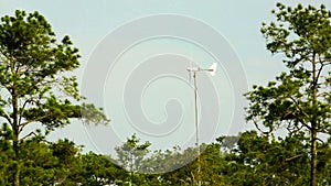 Little wind turbine generating electricity in nature.