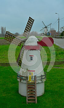 Little windmill in a garden