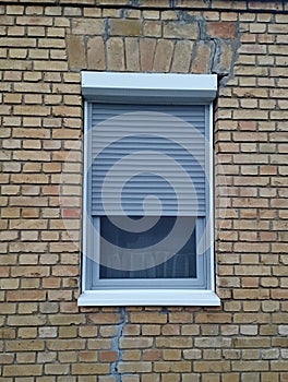 Little window on old brick house in Vojvodina Serbia