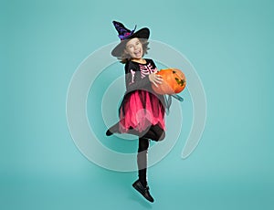 Little witch on turquoise background