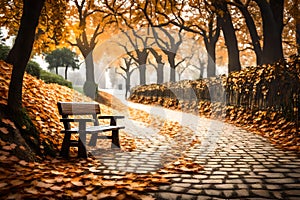 The little wooden bench is empty and situated on a white pathway that is covered in leaves
