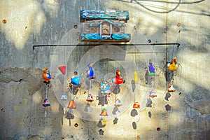 A little wooden birdhouse on concrete wall