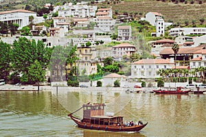 Little wooden boat on Duoro river in Pinhao,Portugal. View from Pinho vilage in Portugal to Douro valey - Photo by Marianarbh1