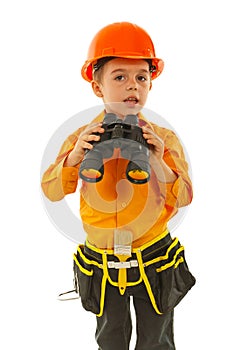 Little worker boy with binocular