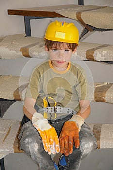 Little workman with security helmet