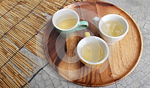 Little yellow cup of white tea.