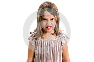 Little young girl is angry, mad, disobedient with bad behaviour