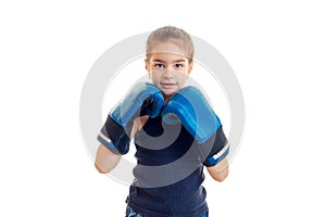 Little young girl practicing boxing