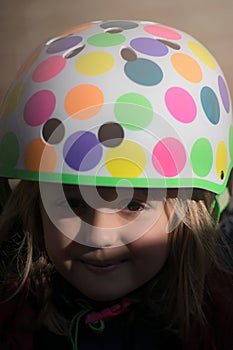 Little young girl wearing cycle helmet